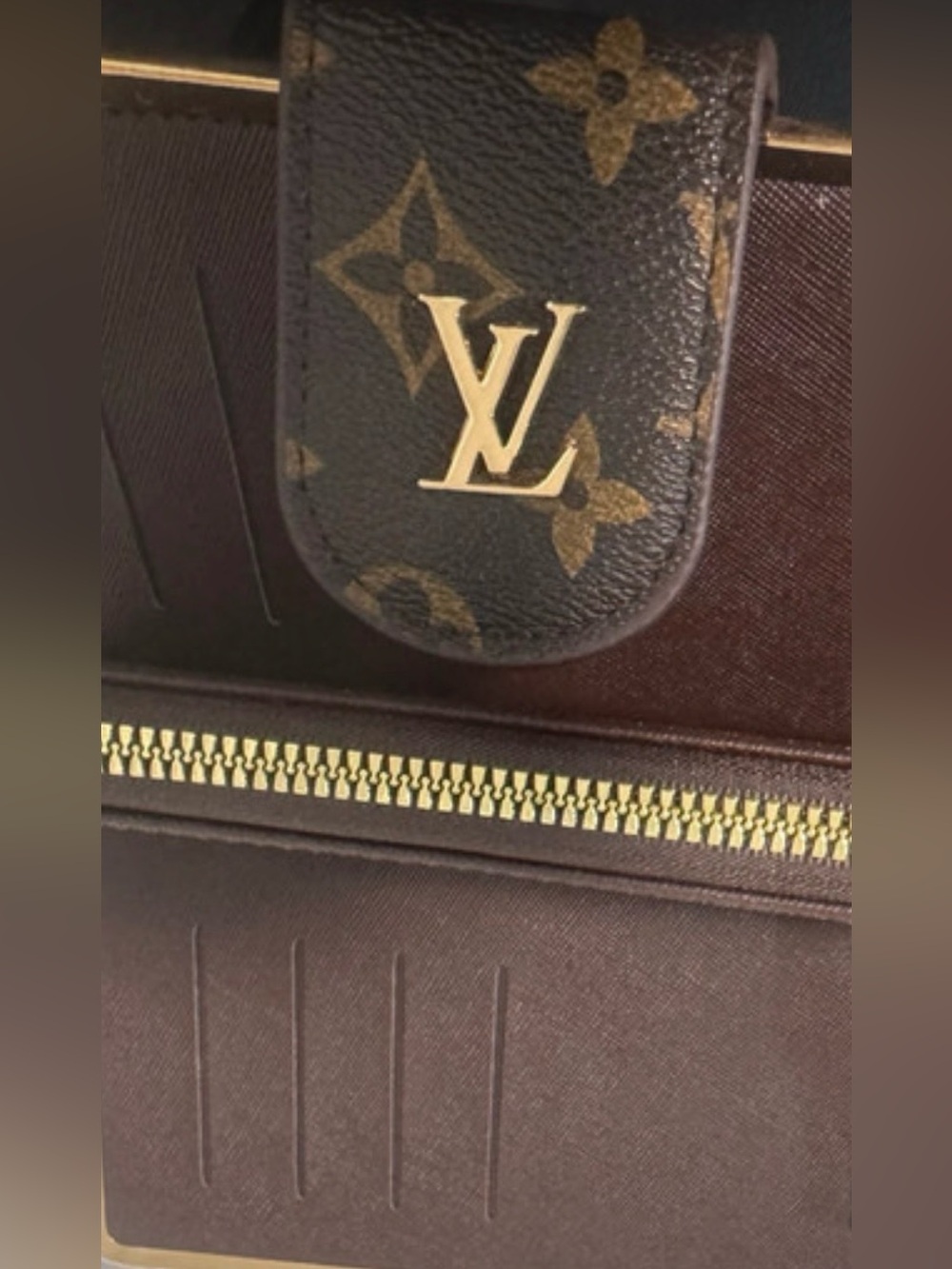 Chic wristlet wallet with shiny hardware baring most fabulous iconic logo😘